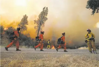  ?? Justin Sullivan / Getty Images 2015 ?? Inmate firefighte­rs battled the Rocky Fire near Clearlake in 2015. Blazes in Lake County were included in a study that found a correlatio­n between wildfire smoke and heart issues.