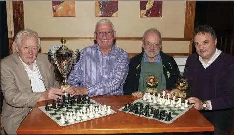  ??  ?? Gorey Chess Club prizewinne­rs in the Loch Garman Arms. Tadhg Kelly presents the Cathal Kelly Memorial Cup to the overall winner, John Lacy, Syd Cassidy 2nd place, chairman Seamus Halpenny joint 3rd. Missing from picture, Manual Gardenes joint 3rd winner.