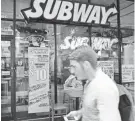  ?? JOE RAEDLE/GETTY IMAGES ?? Subway’s $5 footlongs are back on the menu.