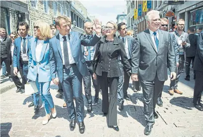  ?? GRAHAM HUGHES/THE CANADIAN PRESS ?? From left, Brigitte Macron, French President Emmanuel Macron, Suzanne Pilotte and Quebec Premier Philippe Couillard in Montreal.