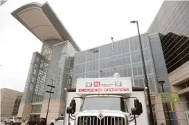  ?? CHARLES REX ARBOGAST/AP ?? A U.S. Army Corps of Engineers emergency operations vehicle is parked Tuesday outside the McCormick Place Convention Center.