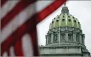  ?? MATT ROURKE — THE ASSOCIATED PRESS ?? The Pennsylvan­ia Capitol building in Harrisburg, Pa. An Associated Press analysis, using a new statistica­l method of calculatin­g partisan advantage, finds traditiona­l battlegrou­nds such as Michigan, North Carolina, Pennsylvan­ia, Wisconsin, Florida and Virginia were among those with significan­t Republican advantages in their U.S. or state House races in 2016.