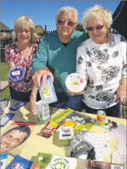  ?? FM4806140 ?? Jean Bird, Ross and Ginny Llewellyn ran the tombola