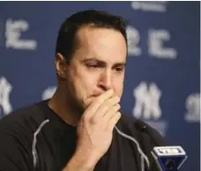  ?? SETH WENIG/THE ASSOCIATED PRESS ?? Yankees first baseman Mark Teixeira became emotional while talking to reporters about his retirement on Friday. “Teixeiras are criers,” he said.