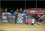  ?? PHOTO COURTESY RICH KEPNER ?? Brian Shuey, left, poses in victory lane after winning the Late Model feature at Grandview Speedway on April 17.