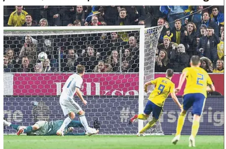  ??  ?? On point: Sweden’s forward Marcus Berg (second from right) shoots to score past Russia’s goalkeeper Andrei Lunev during the UEFA Nations League match at Friends Arena in Solna on Tuesday. — AFP