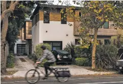  ??  ?? Three homes sit on a single plot of land in Berkeley, Calif. As cities struggle to keep up with demand, they have remade their skylines with condominiu­m and apartment towers — but single-family neighborho­ods, where low-density living is treated as...