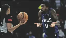  ?? TRIBUNE NEWS SERVICE ?? Sacramento Kings guard Malik Monk (0) reacts after a foul during a game against the Dallas Mavericks on Tuesday at Golden 1 Center in Sacramento.