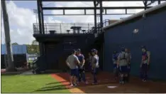  ?? ASSOCIATED PRESS ?? New York Mets baseball catchers chat at the teams spring training facility in Port St. Lucie, Fla., Monday. While the New York Mets focused on adding power and pitching this offseason, one problem area they didn’t address was catcher. They’re still...