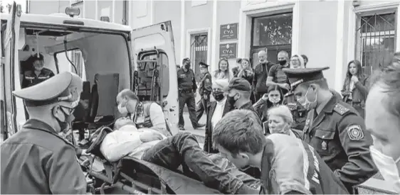  ?? REUTERS ?? A still image taken from video footage shows Belarusian prisoner Stepan Latypov, who was arrested during a security crackdown on mass protests following a contested presidenti­al election in 2020, being carried out of a court building after a suicide attempt in Minsk, Belarus on Tuesday.