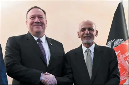  ?? ANDREW CABALLERO-REYNOLDS — POOL PHOTO VIA AP ?? US Secretary of State Mike Pompeo, left, shakes hands with Afghan President Ashraf Ghani,during the 56th Munich Security Conference (MSC) in Munich, southern Germany, on Friday, Feb. 14.