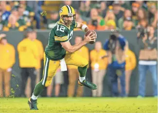  ?? JEFF HANISCH, USA TODAY SPORTS ?? With near-flawless play, Aaron Rodgers has led the Packers to eight consecutiv­e victories.