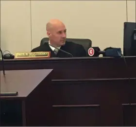  ?? ANDREW CASS — THE NEWS-HERALD ?? Painesvill­e Municipal Court Judge Paul Malchesky listens to a defendant during a video arraignmen­t in January.