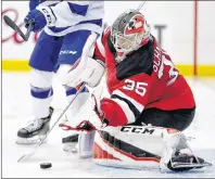  ?? AP PHOTO ?? New Jersey Devils goaltender Cory Schneider blocks a shot from the Tampa Bay Lightning during NHL playoff action Monday night in Newark, N.J.