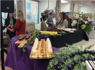  ?? (Staff photo by Mallory Wyatt) ?? CHRISTUS St. Michael Health System staff celebrate the opening of the hospital’s new infusion wing Tuesday in Texarkana, Texas.