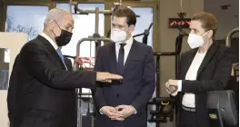  ?? AVIGAIL UZI AP ?? Israeli Prime Minister Benjamin Netanyahu, left, visits a fitness gym Thursday in Modi’in, Israel, with Austrian Chancellor Sebastian Kurz, center, and Danish Prime Minister Mette Frederikse­n to observe how the ‘Green Pass’ for vaccinated citizens is used.