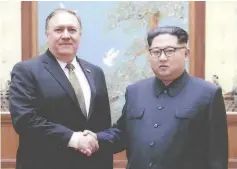  ?? — AFP photo ?? File photo shows Kim (right) shaking hands with Pompeo in Pyongyang over the Easter weekend.