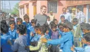  ?? HT FILE ?? Facebook founder Mark Zuckerberg interacts with children during his visit to Chandoli school in 2014.