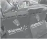  ?? PATRICK T. FALLON, BLOOMBERG ?? Walmart also cited costs associated with investment­s in higher wages and increased training.