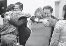  ?? Hearst Connecticu­t Media file photo ?? Plaintiffs hug lawyers after the verdict and reading of damages in a trial against Alex Jones in October in Waterbury, Conn.