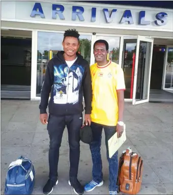  ??  ?? CHARTING NEW WATERS . . . Cameroonia­n forward Albert Eonde is welcomed at the Robert Mugabe Internatio­nal Airport by a friend Gilbert Sengwe on Sunday