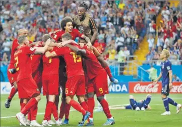  ?? AP ?? Belgium's players celebrate Nacer Chadli's matchwinne­r against Japan during their Round of 16 match in Samara on Monday.