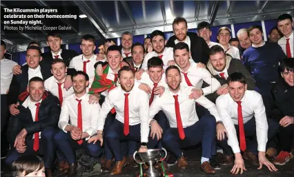  ?? The Kilcummin players celebrate on their homecoming on Sunday night.
Photos by Michelle Cooper Galvin ??