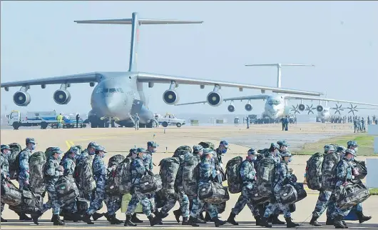  ?? FAN XIANHAI / FOR CHINA DAILY ?? On Feb 17, 2020, a batch of medical personnels dispatched by the military to support Wuhan’s fight against the COVID-19 arrive in Wuhan on an Air Force transport plane.