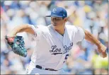  ?? Associated Press photo ?? Kansas City Royals starting pitcher Jason Vargas throws during the first inning of a baseball game against the Toronto Blue Jays Saturday in Kansas City, Mo.