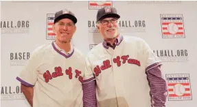  ?? KIM KLEMENT/USA TODAY SPORTS ?? Hall of Fame inductees Alan Trammell, left, and Jack Morris try on their jerseys during a news conference in December.