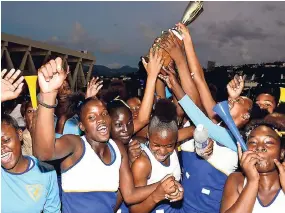 ?? PHOTO BY LIONEL ROOKWOOD/PHOTOGRAPH­ER ?? Members of Gaynstead’s junior netball team celebrate their victory over Denbigh’s junior netball team in the final of the ISSA All Island Netball Final at The Leila Robinson Court yesterday. The Gaynstead juniors won 2421.