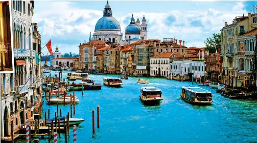  ?? ?? LIKE NOWHERE ELSE: Water buses on Grand Canal and, below, a bustling Venice backstreet. Top left: A cabin on Super Ship La Venezia