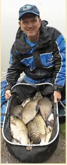  ??  ?? Darren Cox shows off his afternoon haul of carp and bream taken on the pole.