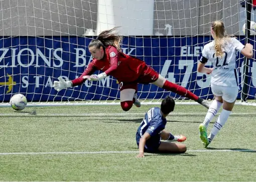  ?? Maddie Meyer/Getty Images ?? Morgan Weaver of Portland Thorns FC scores in the 68th minute in a 1-0 upset win against the North Carolina Courage Friday in the quarterfin­als of the NWSL Challenge Cup. Portland is the eighth seed, and North Carolina is the two-tme defending league champion.