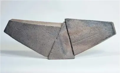  ?? COURTESY OF TOUCHING STONE GALLERY ?? “Formation I” is a wood-fired black stoneware sculpture by Jonathan Cross.