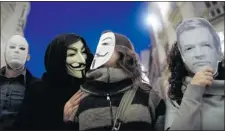  ?? JON NAZCA/ REUTERS ?? Anonymous has many faces, and many members capable of using modern social media for its many activities, says the CSIS report.
