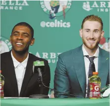  ?? AP PHOTO ?? FRESH STARTS: Kyrie Irving (left), whose trade to the Celtics finally became official Wednesday night, and free agent signee Gordon Hayward smile yesterday at the Garden.