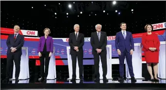  ?? CHARLIE NEIBERGALL — THE ASSOCIATED PRESS ?? From left, Democratic presidenti­al candidates businessma­n Tom Steyer, Sen. Elizabeth Warren, D-Mass., former Vice President Joe Biden, Sen. Bernie Sanders, I-Vt., former South Bend Mayor Pete Buttigieg, and Sen. Amy Klobuchar, D-Minn., stand on stage, Tuesday before a Democratic presidenti­al primary debate hosted by CNN and the Des Moines Register in Des Moines, Iowa.