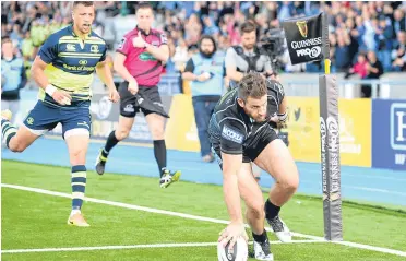  ??  ?? Tommy Seymour touches down for his first try against Leinster at Scotstoun.