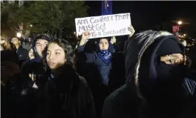  ?? Photograph: Noah Berger/AP ?? A University of California, Berkeley student joins protesters outside a speech by Ann Coulter in Berkley, California, on 20 November.