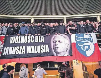  ??  ?? Hero to some: Fans of Petrochemi­a Płock at a match in Austria display a banner glorifying assassin Janusz Walus. Scarves and T-shirts bearing his name and image have been offered for sale on OLX Poland, as seen in the adverts below, and are increasing­ly common at local football matches.