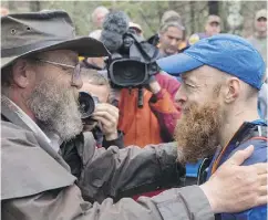  ?? MICHAEL DOYLE ?? Race director Gary Cantrell and runner Gary Robbins at the 60-hour Barkley Marathons in Wartburg, Tenn.