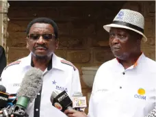  ??  ?? Oburu Odinga, brother of Alliance candidate Raila Odinga, and senator James Orengo criticise the police raid at their offices