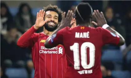  ??  ?? Liverpool’s Mohamed Salah, left, celebrates with team-mate Sadio Man´e during the 4-1 Champions League win in Genk on Wednesday evening. Photograph: François Walschaert­s/AFP via Getty Images