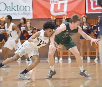  ?? WORSOM ROBINSON/FOR THE SUN-TIMES ?? Evanston’s Jaheim Holden tries to reach in for a steal against New Trier’s Spencer Boehm on Friday.