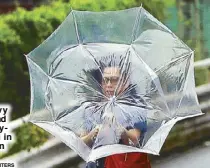  ?? REUTERS ?? A woman struggles against heavy rain and wind caused by Typhoon Faxai in Tokyo, Japan yesterday.