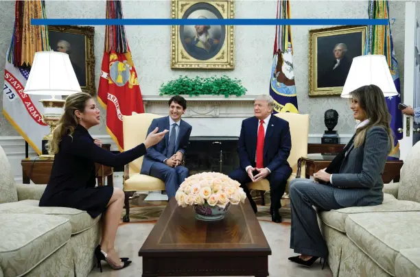  ?? Adam Scotti photo ?? Prime Minister Trudeau and President Trump, accompanie­d by Sophie Grégoire-Trudeau and Melania Trump in the Oval Office at the White House, October 11, 2017.