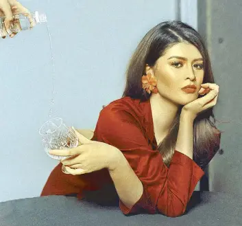  ??  ?? Red suit, Araw the Line; Clip-on earrings, Matthew & Melka by Ken Samudio