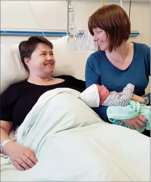  ??  ?? Below right: Ruth Davidson, the then leader of the Scottish Conservati­ves, is flanked by her partner, Jen Wilson, after giving birth to a baby boy, Finn Paul.