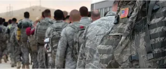  ?? — AFP photo ?? US army soldiers queue to board a plane to begin their journey home out of Iraq from the al-Asad Air Base west the capital Baghdad on Nov 1, 2011. Iran-backed militants on Saturday launched ballistic missiles at the base hosting US forces in western Iraq.